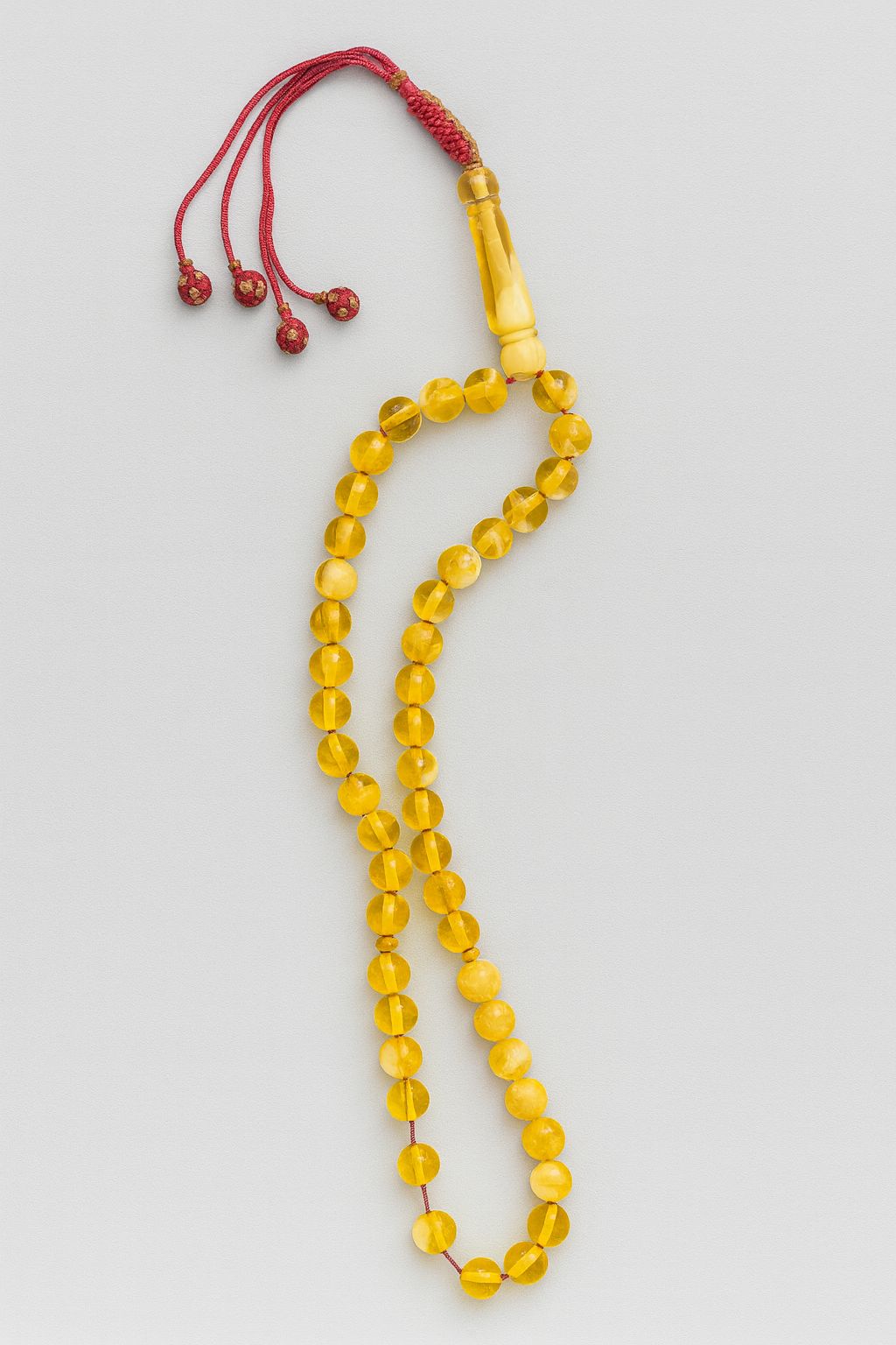 Yellow Misbah with Red Karkoosha by Al Jazeera