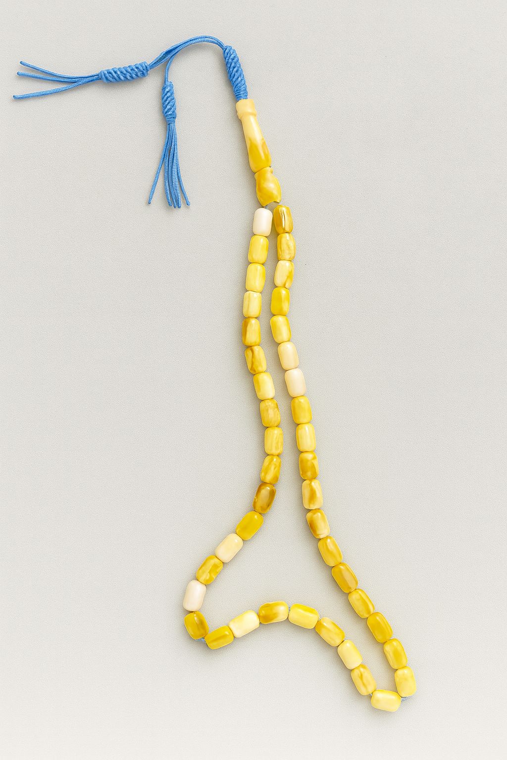 Yellow Misbah with Blue Karkoosha by Al Jazeera